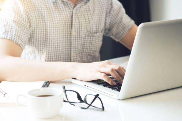 istock Young man is typing on laptop computer keyboard. Internet learning, surfing concept. 1178552876