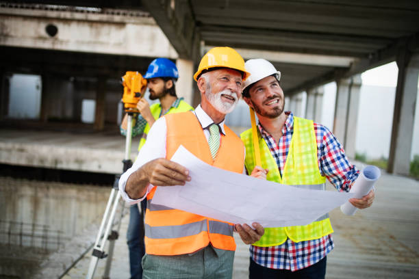 istock Team of architects and engineer in group on construciton site check documents and business workflow 1178553203