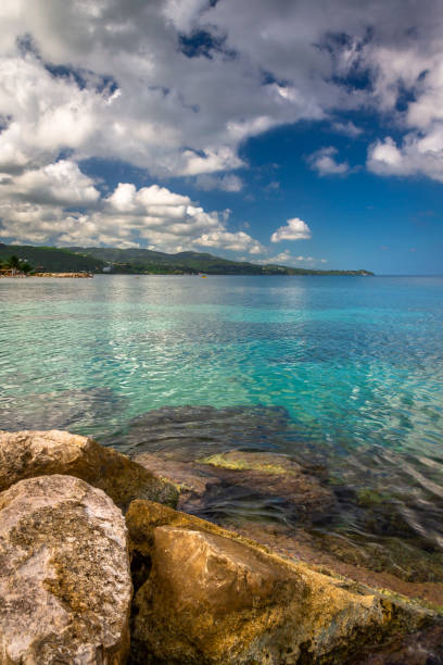 Jamaica view of the shore Coastal exposure with sea an beach view done in Montego Bay, Jamaica. falmouth harbor stock pictures, royalty-free photos & images