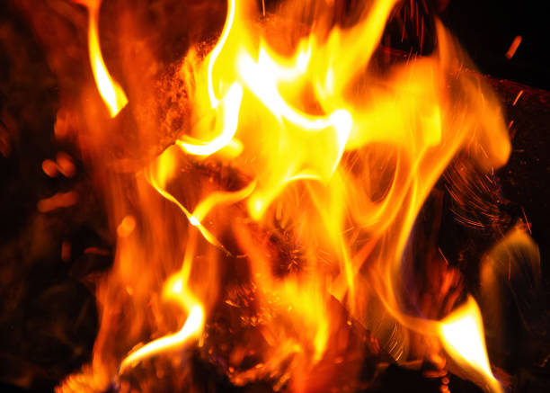 istock Fire flame and sparks texture on a black background. Abstract background 1178554475