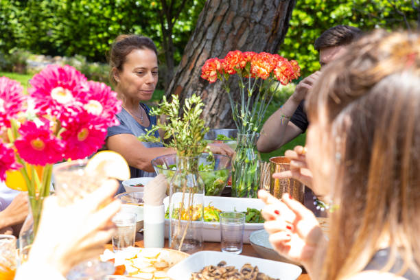 istock Friends sitting at table in yard 1178554701
