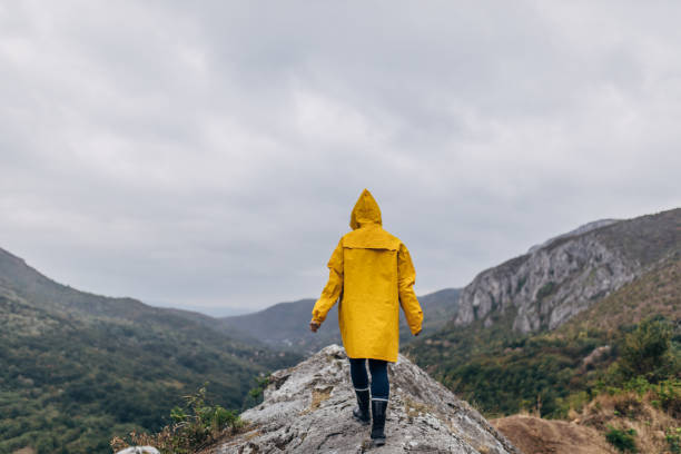 istock Woman hiking alone on a rainy day 1178554792