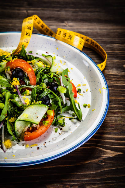 istock Vegetable salad on wooden background 1178557080