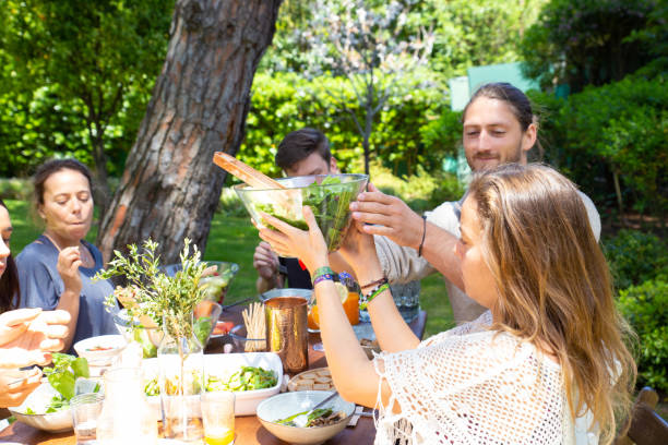 istock Cheerful young people at table in yard 1178557237