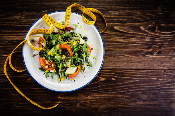 istock Vegetable salad on wooden background 1178557281