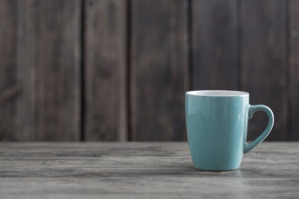 istock clean cup on old wooden background 1178558070
