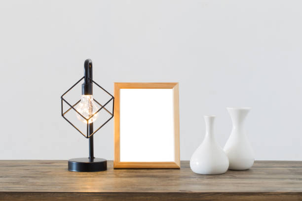 istock metal black lamp and wooden frame in white interior 1178558096