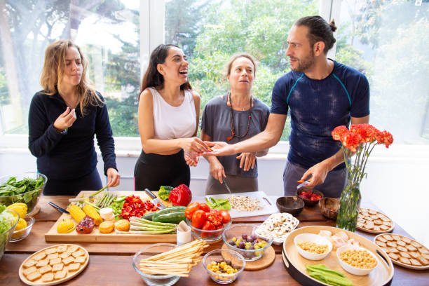 istock Happy friends preparing healthy meal 1178558332