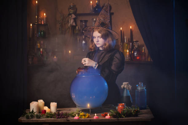 istock young witch in home. Halloween concept 1178558740