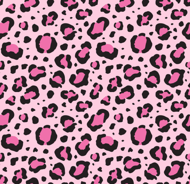Vector seamless pattern of black leopard spots on pink Vector seamless pattern of black leopard spots isolated on pink background leopard big cat animal africa stock illustrations