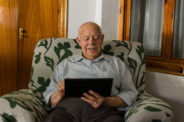 istock Elderly man is using a digital tablet at home. 1178559960