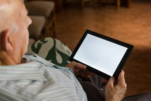 istock Elderly man is using a digital tablet at home. 1178560053