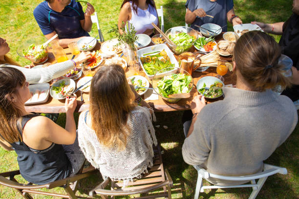 istock Young friends at table outdoor 1178560471