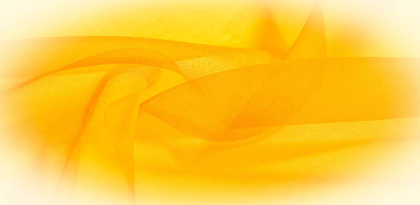 istock Texture of yellow silk fabric. It is also perfect for your design, clothes, posters. Be creative with beautiful project accents. This fabric is inspired by your inspiration. 1178562425