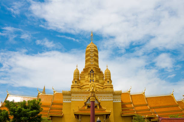 Golden Buddhist church with beautiful sky