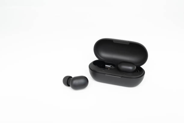 istock Black true wireless earbuds with power bank case on the white isolated background 1178563058