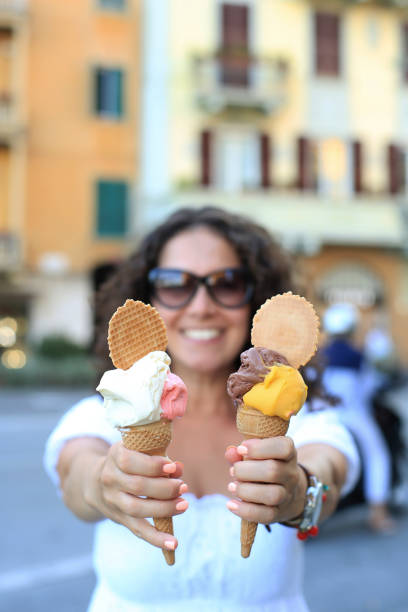 istock Beautiful girl holding an ice cream 1178563765