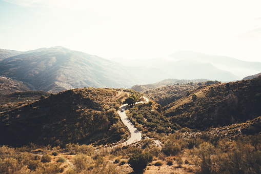 Country road through Andalusian rural landscape (Sierra Nevada, Spain).