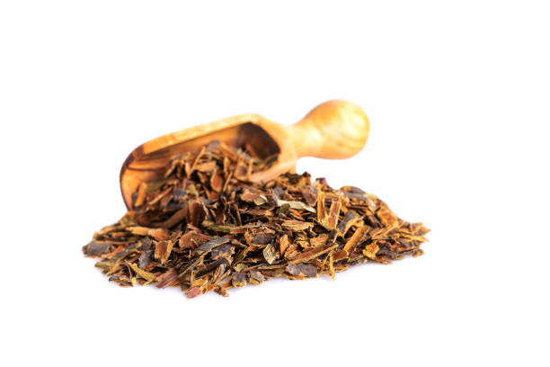 istock Alder buckthorn bark in wooden scoop isolated on white 1178565521