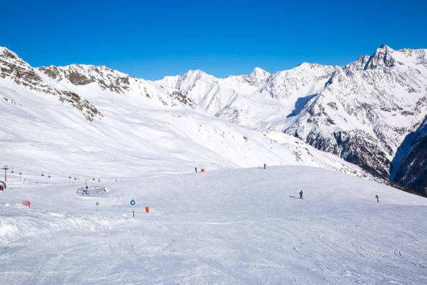 istock Ski slopes in winter, Alp mountains. Bright winter day, blue sky. 1178568689