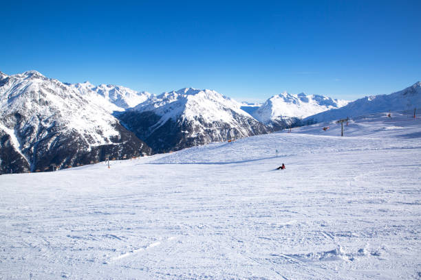 istock Ski slopes in winter, Alp mountains. Bright winter day, blue sky. 1178568705
