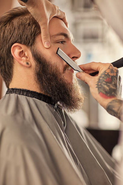 istock Barber man grooming with scissors of real hipster 1178573641