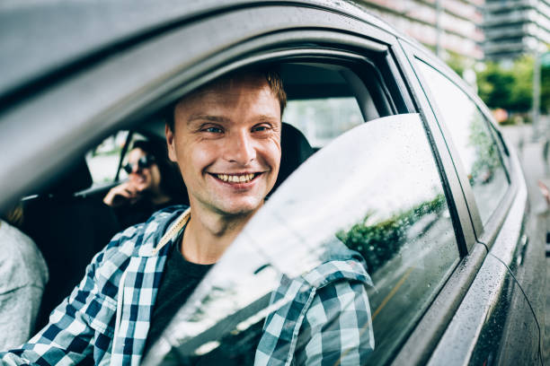 istock Friends enjoying a ride in a rental car 1178574372
