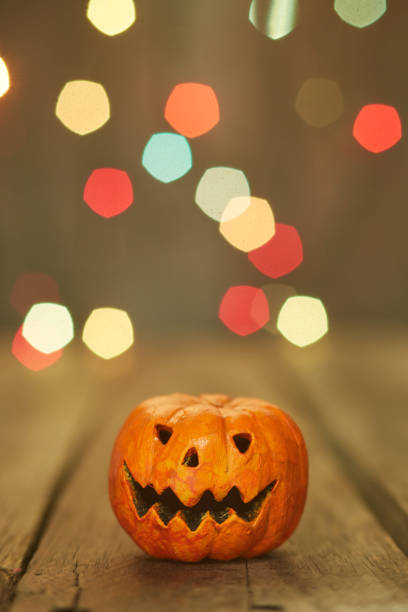 istock Halloween pumpkin on a bokeh lights background 1178579047