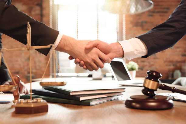 Law and justice concept with attorney Lawyer and his client handshake. Agreement with attorney in office. Law and justice concept notary photos stock pictures, royalty-free photos & images