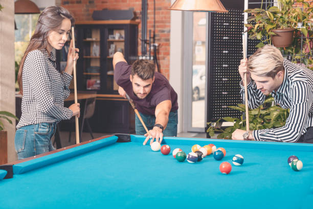 istock Group of employees playing in billiards at office 1178579272