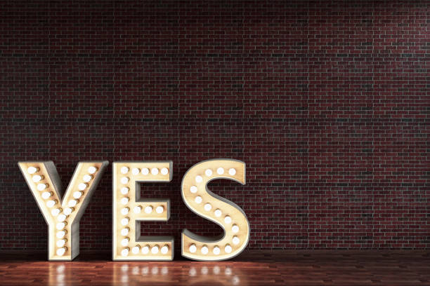 istock Yes Light Bulb Sign Against Brick Wall 1178579294