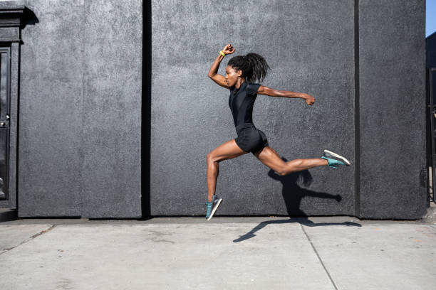 istock Afro american woman with dreadlocks in a great athletic shape working out and training hard outdoors 1178579349
