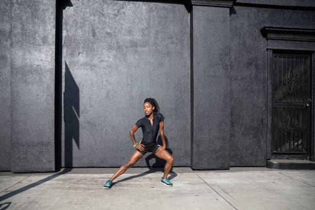 istock Afro american woman with dreadlocks in a great athletic shape working out and training hard outdoors 1178579377