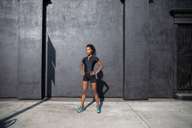 istock Afro american woman with dreadlocks in a great athletic shape working out and training hard outdoors 1178579445