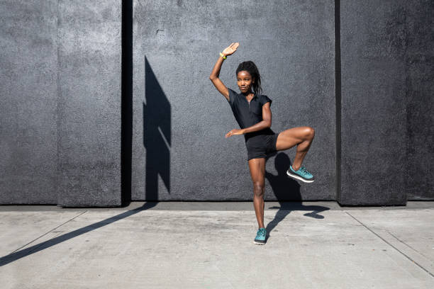 istock Afro american woman with dreadlocks in a great athletic shape working out and training hard outdoors 1178579497
