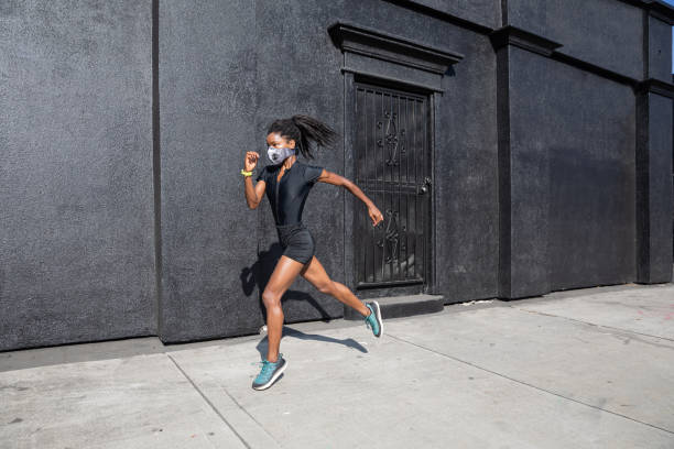 istock Afro american woman with dreadlocks in a great athletic shape working out and training hard outdoors 1178579566