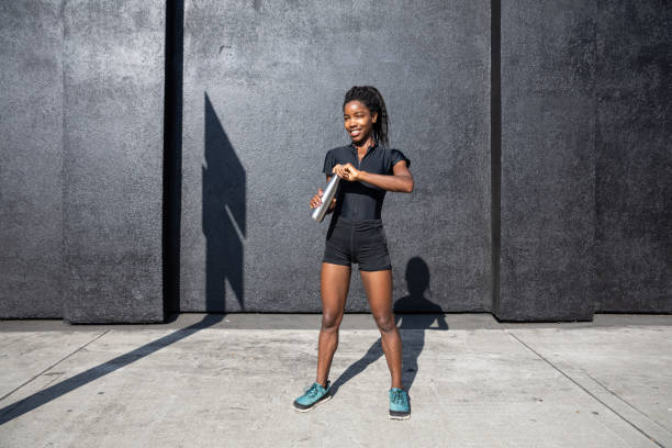 istock Afro american woman with dreadlocks in a great athletic shape working out and training hard outdoors 1178579666