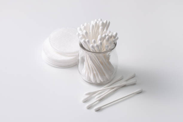 istock Cotton buds in a jar, cotton pads on a gray background. 1178580845