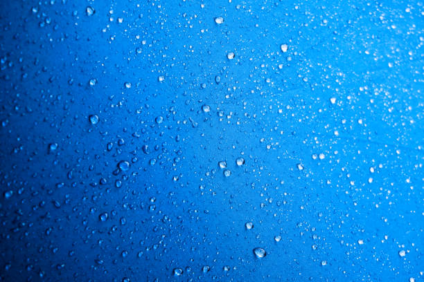 istock Water drops on the blue fabric.water drops on blue 1178588611