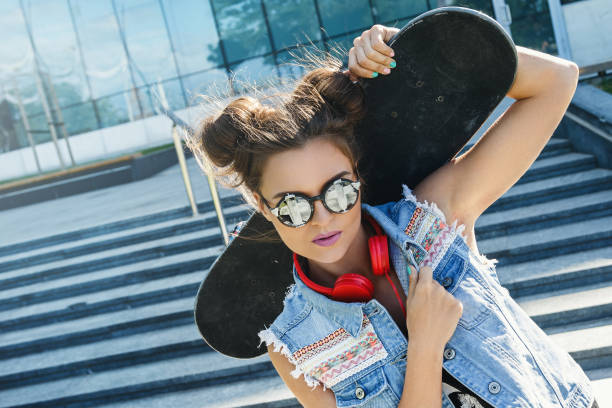 istock Stylish girl with a skateboard 1178591515
