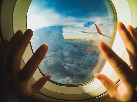 POV of Enjoy the view. A man is enjoying the flight.