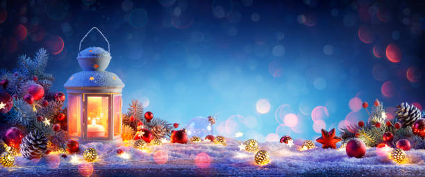 istock Christmas Lantern On Snowy Table With Fir Branches And Ornaments 1178595569