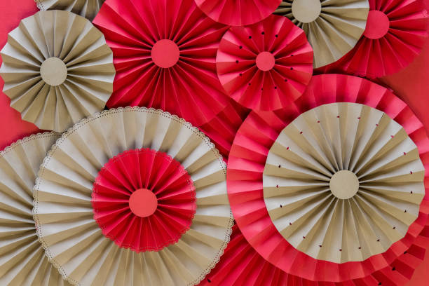 istock Paper fan tutorial. Origami flowers. Simple paper rosettes decoration DIY. 1178599103