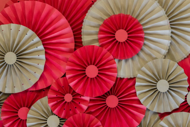 istock Paper fan tutorial. Origami flowers. Simple paper rosettes decoration DIY. 1178599585