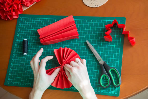 istock Handmade art from tissue paper. DIY paper pompon. 1178600297