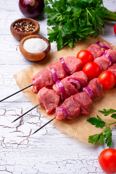 istock Raw shish kebab skewers with tomatoes 1178600522