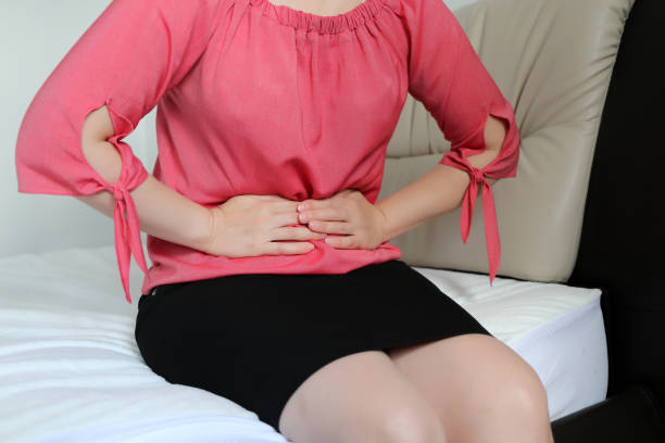 istock Woman suffering from stomach ache 1178600914