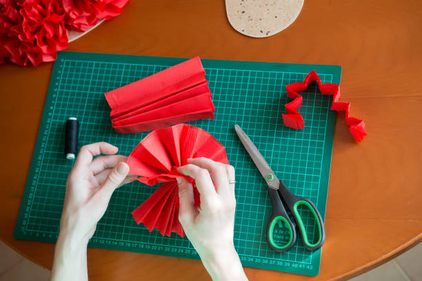 istock Handmade art from tissue paper. DIY paper pompon. 1178601126