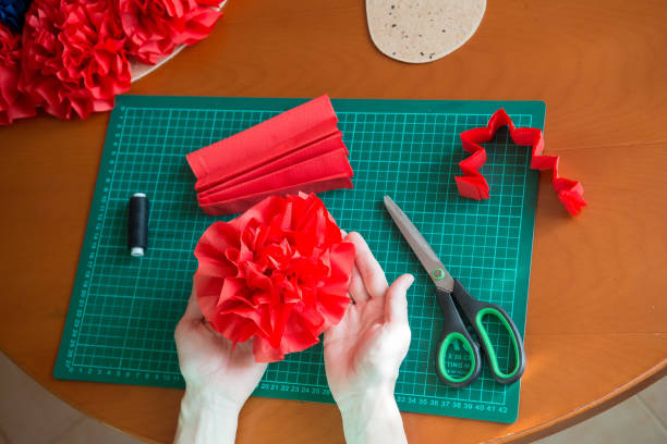 istock Handmade art from tissue paper. DIY paper pompon. 1178601128