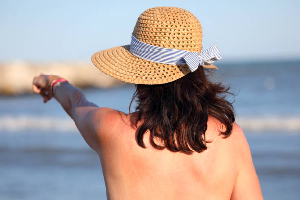 istock pretty girl with straw boater hat 1178601691